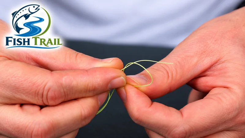 Passing the tag end through the loop when tying a clinch knot for a mormyshka