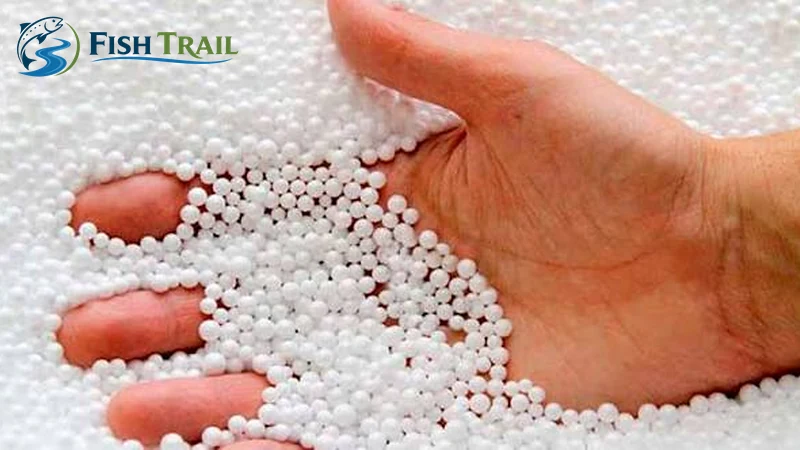 Small white foam balls held in a hand
